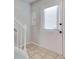 Bright entryway with tile flooring and white door at 6622 Wellington Sq, Norcross, GA 30093