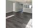 Spacious living room with dark gray luxury vinyl plank flooring at 6622 Wellington Sq, Norcross, GA 30093