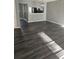 Living room featuring dark gray luxury vinyl plank flooring at 6622 Wellington Sq, Norcross, GA 30093