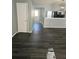 Living room with dark gray luxury vinyl plank flooring at 6622 Wellington Sq, Norcross, GA 30093
