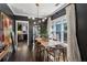 Bright dining room with dark walls, hardwood floors, and a stylish light fixture at 1060 Shelby Pl, Atlanta, GA 30316