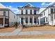 Two-story home with white siding, brick accents, and a front porch at 124 Stonehouse Dr, Cumming, GA 30040