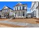 Two-story home with white siding, brick accents, and a front porch at 124 Stonehouse Dr, Cumming, GA 30040