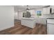 Modern kitchen with white cabinets and spacious island at 3317 Ward Sw Dr, Atlanta, GA 30354