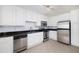 Updated kitchen, featuring stainless steel appliances and white cabinets at 1468 Briarwood Ne Rd # 2003, Atlanta, GA 30319