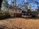 Spacious backyard with a screened porch and wooden privacy fence at 1193 Kelton Dr, Stone Mountain, GA 30083