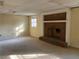 Finished basement with a brick fireplace and carpeted floors at 1193 Kelton Dr, Stone Mountain, GA 30083