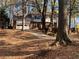 Brick and shingle two-story house with attached garage and driveway at 1193 Kelton Dr, Stone Mountain, GA 30083