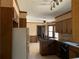Kitchen features wood cabinets, granite countertops, and tile flooring at 1193 Kelton Dr, Stone Mountain, GA 30083