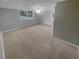 Finished basement area with carpet, neutral walls, and natural light at 2082 Rainbow Dr, Snellville, GA 30039