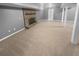 Finished basement featuring a brick fireplace and neutral carpeting at 2082 Rainbow Dr, Snellville, GA 30039