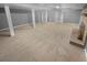 Finished basement area with fireplace and support columns at 2082 Rainbow Dr, Snellville, GA 30039