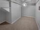 Finished basement area with carpet, neutral walls, and ceiling fan at 2082 Rainbow Dr, Snellville, GA 30039