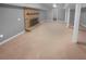 Finished basement area with fireplace and carpet at 2082 Rainbow Dr, Snellville, GA 30039
