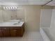 Functional bathroom features vanity, mirror, lighting and bathtub with shower at 2082 Rainbow Dr, Snellville, GA 30039