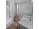 Modern bathroom featuring a shower and a white sink and cabinet at 2082 Rainbow Dr, Snellville, GA 30039