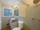 Charming bathroom with shower, updated vanity, and window overlooking mature trees at 2082 Rainbow Dr, Snellville, GA 30039