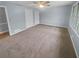 Spacious bedroom featuring neutral walls, carpet, ceiling fan, and ample natural light at 2082 Rainbow Dr, Snellville, GA 30039