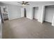 Spacious carpeted bedroom with ceiling fan and ample closet space at 2082 Rainbow Dr, Snellville, GA 30039