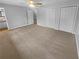 Bright bedroom boasts neutral walls, carpet, ceiling fan, and large closet at 2082 Rainbow Dr, Snellville, GA 30039