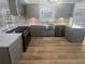 Well-lit kitchen features stainless steel appliances, granite countertops, and stylish backsplash at 2082 Rainbow Dr, Snellville, GA 30039