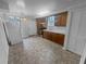 Efficient kitchen layout with appliances, cabinets, and access to backyard at 2082 Rainbow Dr, Snellville, GA 30039