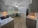 Spacious kitchen with stainless steel appliances, granite countertops, and views to the living room at 2082 Rainbow Dr, Snellville, GA 30039