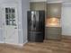 Kitchen featuring stainless steel refrigerator with cabinets and countertops at 2082 Rainbow Dr, Snellville, GA 30039