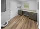 Tidy laundry room with updated countertops and cabinetry at 2082 Rainbow Dr, Snellville, GA 30039