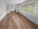 Bright living room with large windows and hardwood floors throughout at 2082 Rainbow Dr, Snellville, GA 30039
