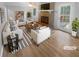 Bright living room with brick fireplace, lots of seating, and ample natural light at 2082 Rainbow Dr, Snellville, GA 30039