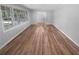Bright and spacious living room with large windows and beautiful hardwood floors at 2082 Rainbow Dr, Snellville, GA 30039