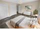 Serene main bedroom with neutral tones and carpet on top of hardwood floor at 2082 Rainbow Dr, Snellville, GA 30039