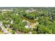 Aerial view showing a community lake and surrounding homes at 2421 Edge Hill Dr, Snellville, GA 30078