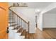 Bright entryway with hardwood floors and an elegant staircase at 2421 Edge Hill Dr, Snellville, GA 30078