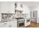 Modern kitchen with stainless steel range and granite countertops at 2421 Edge Hill Dr, Snellville, GA 30078