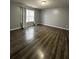 Spacious bedroom with hardwood floors and large window at 16103 Waldrop Cv, Decatur, GA 30034