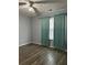 Bedroom with ceiling fan and teal curtains at 16103 Waldrop Cv, Decatur, GA 30034