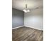 Dining room with gray and white walls and wood-look flooring at 16103 Waldrop Cv, Decatur, GA 30034