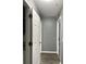 Hallway with gray walls and wood-look floors at 16103 Waldrop Cv, Decatur, GA 30034