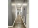 Bright hallway with wood-look floors and neutral walls at 16103 Waldrop Cv, Decatur, GA 30034