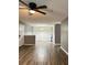 Open living room and dining area with gray walls and wood-look flooring at 16103 Waldrop Cv, Decatur, GA 30034