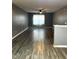 Spacious living room with gray walls and wood-look flooring at 16103 Waldrop Cv, Decatur, GA 30034