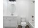 Clean, modern basement bathroom with white vanity and bathtub at 1685 Harbin Sw Rd, Atlanta, GA 30311