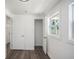 Simple and bright basement bedroom with grey vinyl flooring and an exterior window at 1685 Harbin Sw Rd, Atlanta, GA 30311