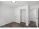 Simple basement bedroom with grey flooring and closet at 1685 Harbin Sw Rd, Atlanta, GA 30311