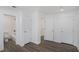 Basement bedroom with grey flooring, bath access, and ample closet space at 1685 Harbin Sw Rd, Atlanta, GA 30311