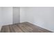 Bright, spacious basement room with grey vinyl flooring and a door at 1685 Harbin Sw Rd, Atlanta, GA 30311