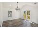 Sunlit dining room with hardwood floors and sliding doors at 1685 Harbin Sw Rd, Atlanta, GA 30311