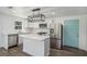 Modern kitchen with white cabinets, island, and stainless steel appliances at 1685 Harbin Sw Rd, Atlanta, GA 30311